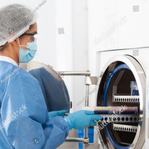 stock-photo-young-female-scientist-sterilizing-laboratory-material-in-autoclave-2286572643